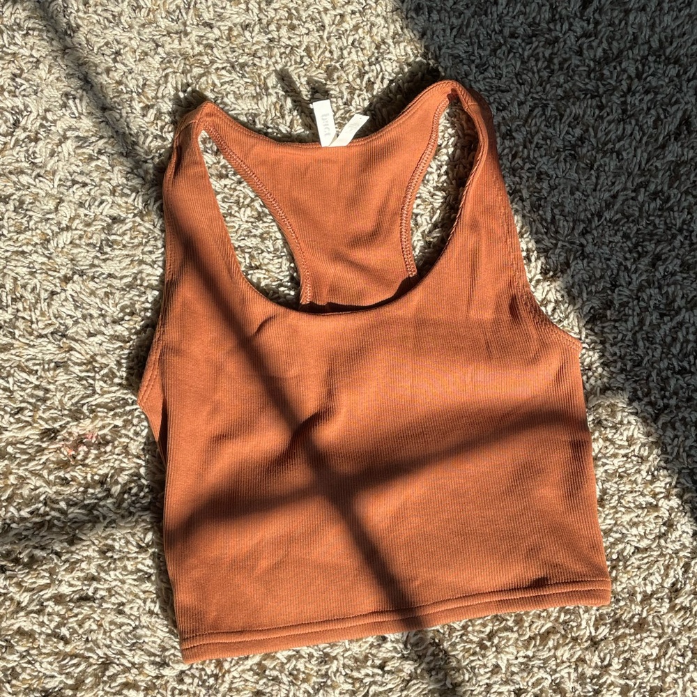 a brown tank top